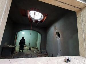A Libyan man stands at the site of shelling on the residential area of Arada in the capital Tripoli on April 14, 2020. The forces of Libyan military strongman Khalifa Haftar rained rockets on Tripoli today after being ousted by government loyalists from a string of strategic towns west of the capital. The capture yesterday of the coastal towns of Sorman and Sabratha and smaller settlements further south was seen as a major blow to Haftar, who in April last year launched an offensive to seize Tripoli.  Mahmu