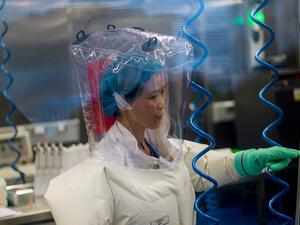 This file photo taken on February 23, 2017 shows a worker inside the P4 laboratory in Wuhan, capital of China's Hubei province. The P4 epidemiological laboratory was built in co-operation with French bio-industrial firm Institut Merieux and the Chinese Academy of Sciences. The facility is among a handful of labs around the world cleared to handle Class 4 pathogens (P4) - dangerous viruses that pose a high risk of person-to-person transmission. JOHANNES EISELE / AFP