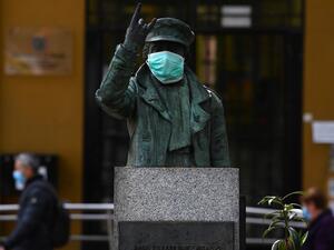 The statue of local legend Angela Rodriguez Hidalgo popularly known as 'the rocker granny', sports a face mask in Puente de Vallecas, one of the poorest districts in Madrid on April 20, 2020 during a national lockdown to prevent the spread of the COVID-19 disease. Spain said 399 people died of COVID-19 over the past 24 hours in what was the lowest daily number of deaths in four weeks, the government said. Gabriel BOUYS / AFP