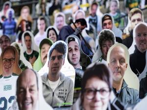 In this file photo taken on April 16, 2020 Cardboard cut-outs with portraits of Borussia Moenchegladbach's supporters are seen at the Borussia Park football stadium in Moenchengladbach, western Germany, amid the novel coronavirus COVID-19 pandemic. German football authorities are set to announce plans on April 23, 2020 for Bundesliga matches to restart on May 9 in empty stadiums, but the potential return in the midst of the coronavirus pandemic is meeting some opposition. Ina FASSBENDER / AFP