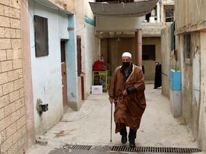 An Elderly man wearing a face mask walks through an alley at the Wavel Palestinian refugee camp (also known as the Jalil camp) in Lebanon's eastern Bekaa Valley, on April 24, 2020, after cases of infection by the novel coronavirus were detected there. The residents of the Wavel camp were tested after a member of a household, a Palestinian refugee from Syria, was admitted to the state-run Rafic Hariri hospital in the capital Beirut for demonstrating COVID-19 symptoms. AFP