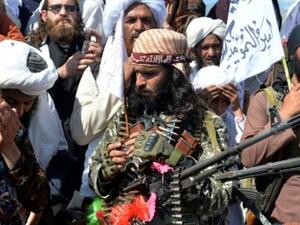 Afghan Taliban fighters and villagers attend a gathering in Alingar district of Laghman Province on the day the militants said they were resuming operations against Afghan government targets File photo AFP