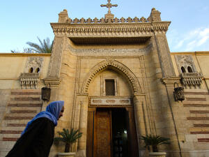 An Old Egyptian Copt walking past the entrance to the Hanging Church of Coptic Cairo, Egypt. (Shutterstock/ File Photo)