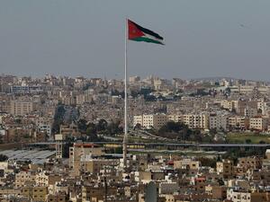 A picture taken on April 27, 2020, shows the Jordanian flying waving in the wind over the capital Amman, during the Muslim holy month of Ramadan. Khalil MAZRAAWI / AFP
