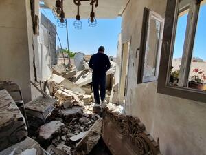 A resident walks amidst the rubble of a building that was damaged when forces loyal to eastern-based strongman Khalifa Haftar shelled the residential neighbourhood of Znatah in the Libyan capital Tripoli, held by the UN-recognised Government of National Accord (GNA), on May 1, 2020. AFP