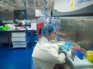 This file photo taken on February 23, 2017 shows a worker inside the P4 laboratory in Wuhan, the capital of China's Hubei province. The Chinese biosafety laboratory accused by top US officials of being at the origin of the coronavirus pandemic studies the world's most dangerous diseases, with researchers who investigate viruses that live in bats. Johannes EISELE / AFP