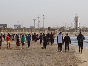 Libyans exercise at the beach before "iftar", or breaking the fast at sunset, during the Muslim holy month of Ramadan in the capital Tripoli, despite a lockdown due to the COVID-19 pandemic, on May 8, 2020. Mahmud TURKIA / AFP