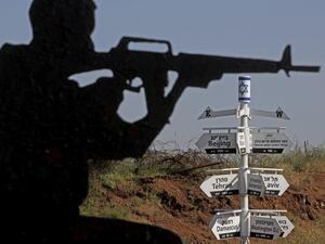 This picture taken on May 12, 2020 from a tourist lookout point at an Israeli army outpost on Mount Bental in the Israeli-annexed Golan Heights shows a directional sign for cities and places across the world and listing their respective distances. JALAA MAREY / AFP