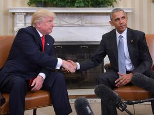 In this file photo US President Barack Obama and President-elect Donald Trump shake hands during a transition planning meeting in the Oval Office at the White House in Washington, DC. President Donald Trump broke with tradition on May 14 by calling for investigation of his White House predecessor Barack Obama in the latest attempt to push a conspiracy theory about his Democratic opponents. JIM WATSON / AFP
