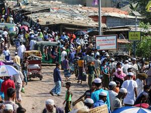 Rohingya refugees gather at a market as first cases of COVID-19 coronavirus have emerged in the area, in Kutupalong refugee camp in Ukhia on May 15, 2020. (AFP/File)
