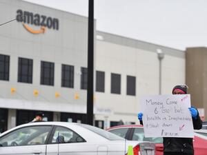 In this file photo taken on March 30, 2020 Amazon workers at Amazon's Staten Island warehouse strike in demand that the facility be shut down and cleaned after one staffer tested positive for the coronavirus in New York. (AFP)