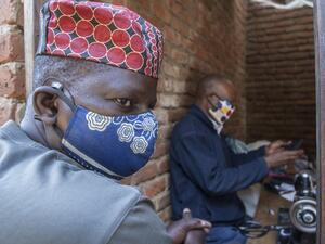 A man wears a face mask as preventive measure against the COVID-19 coronavirus inside Lilongwe City market in Lilongwe on May 18, 2020. AMOS GUMULIRA / AFP