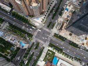 An aerial photo shows buildings and streets in Wuhan, China’s central Hubei province on May 20, 2020. China has largely brought the coronavirus under control within its borders since the outbreak first emerged in the city of Wuhan late last year. Hector RETAMAL / AFP