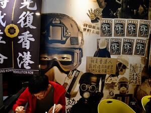 A man eats lunch at the Aegis, a restaurant started by a Hong Kong lawyer which helps Hongkongers who have left the city, in Taipei on May 27, 2020. (AFP)