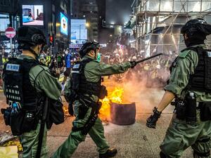 Hong Kong police cast a dragnet around the financial hub's legislature on May 27, firing pepper-ball rounds and arresting hundreds as they stamped down on protests against a bill banning insults to China's national anthem. ISAAC LAWRENCE / AFP