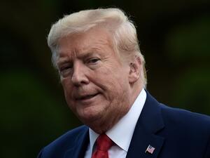 US President Donald Trump walks across the South Lawn upon his return to the White House in Washington, DC on May 27, 2020. SpaceX's landmark launch to the International Space Station -- the first crewed mission to blast off from US soil in almost a decade -- was scrubbed today due to bad weather. Olivier DOULIERY / AFP