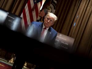 U.S. President Donald Trump listens as he attends a meeting with the Arkansas Governor Asa Hutchinson and Kansas Governor Laura Kelly in the Cabinet Room of the White House May 20, 2020 in Washington, DC. Doug Mills-Pool/Getty Images/AFP