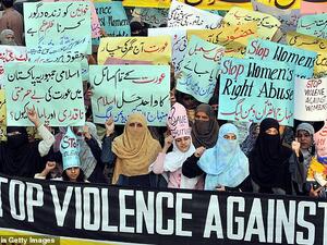 The video that they were 'honour-killed' for showed a young man recording himself with them and another girl in a secluded area. Pictured: An Islamic Organisation protest against 'honour killings' of women in Lahore on November 21, 2008. (AFP)