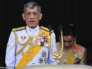Thailand's King Maha Vajiralongkorn and Queen Suthida appear on the balcony of Suddhaisavarya Prasad Hall of the Grand Palace. (AFP/File)