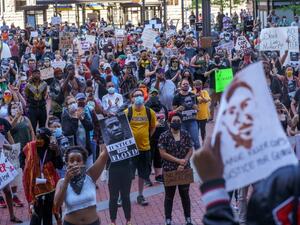 Protesters call for justice for George Floyd, a black man who died after a policeman kneeled on his neck for several minutes, at Hennepin County Government Plaza, on May 28, 2020 in Minneapolis (AFP/Kerem Yucel)