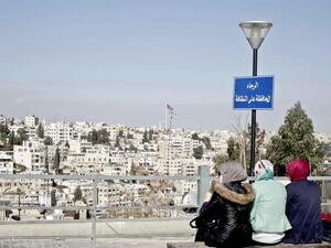 Jordan women enjoy a view of Amman (AFP File Folder)