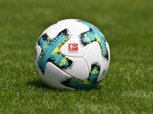 a football with the logo of the German first division football league Bundesliga is displayed (Photo: AFP)