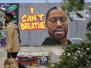 A graffiti depicting a portrait of George Floyd, a black man who died in Minneapolis after a white policeman kneeled on his neck for several minutes is seen in Berlin's Mauer Park on May 30, 2020. Odd ANDERSEN / AFP