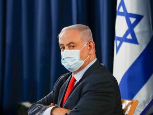 Israeli Prime Minister Benjamin Netanyahu, wearing a protective face mask, chairs the weekly cabinet meeting in Jerusalem on May 31, 2020. RONEN ZVULUN / POOL / AFP
