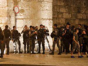 Israeli border guards stand at attention during the funeral of Iyad Hallak, a disabled Palestinian man who was shot dead by Israeli police after they mistakenly thought he was armed with a pistol, in Jerusalem late on May 31, 2020. Ahmad GHARABLI / AFP