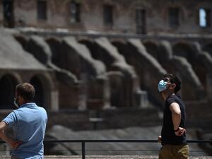Visitors view the Colosseum monument which reopens to the public on June 1, 2020 in Rome, while the country eases its lockdown aimed at curbing the spread of the COVID-19 infection, caused by the novel coronavirus. The Colosseum monument reopens on June 1, 2020 after having been closed since March 8, 2020, with adequate sanitary protection for staff and visitors, secure routes, compulsory reservations and modified schedules to avoid crowds at peak times. Filippo MONTEFORTE / AFP
