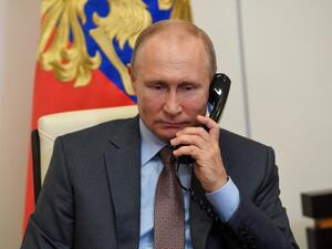 Russian President Vladimir Putin listens to Russian Prime Minister Mikhail Mishustin during their teleconference meeting on Russia's economy recovery at Novo-Ogaryovo state residence, outside Moscow, on June 2, 2020. Russia plans to spend about USD 72 billion (65 billion euro) on a plan to restore the economy following the coronavirus shutdown, Prime Minister Mikhail Mishustin said. Sputnik / AFP