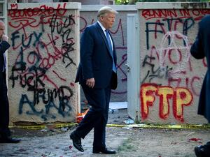US President Donald Trump walks back to the White House escorted by the Secret Service after appearing outside of St John's Episcopal church across Lafayette Park in Washington, DC on June 1, 2020. US President Donald Trump was due to make a televised address to the nation on Monday after days of anti-racism protests against police brutality that have erupted into violence. The White House announced that the president would make remarks imminently after he has been criticized for not publicly addressing in 