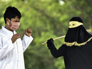 A man reacts as he receives 100 whippings by religious police as punishment for pre-marital sex, outside a mosque in Jantho, Aceh province on June 5, 2020. CHAIDEER MAHYUDDIN / AFP