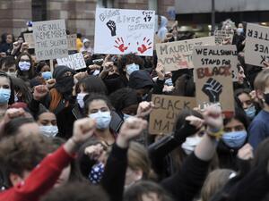 Demonstrators, some wearing a protective face mask, raise their fists during a protest in Strasbourg, eastern France, on June 5, 2020, in solidarity with protests raging across the United States over the death of George Floyd, an unarmed black man who died during an arrest on May 25. (FREDERICK FLORIN / AFP)