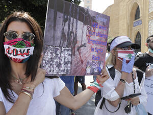 Mask-clad Lebanese protesters take part in a demonstration in central Beirut, on June 6, 2020. Protesters poured into the streets of the Lebanese capital to decry the collapse of the economy, as clashes erupted between supporters and opponents of the Iran-backed Shiite group Hezbollah. ANWAR AMRO / AFP