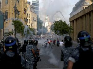 Lebanese riot police fire tear gas at protesters in central Beirut on June 6, 2020. Protesters poured into the streets of the Lebanese capital to decry the collapse of the economy, as clashes erupted between supporters and opponents of the Iran-backed Shiite group Hezbollah. PATRICK BAZ / AFP
