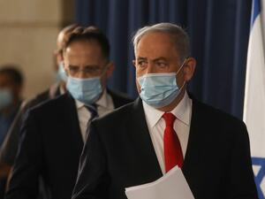 Israeli Prime Minister Benjamin Netanyahu arrives to the weekly cabinet meeting in Jerusalem on June 7, 2020. Netanyahu urged world powers to reimpose tough sanctions against Iran, vowing to curb Tehran's regional "aggression" hours after another deadly strike on pro-Iranian fighters in Syria. Menahem KAHANA / AFP