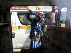 A Yemeni worker sprays disinfectant inside a van used for public transportation in the capital Sanaa, during the ongoing novel coronavirus pandemic crisis, on June 10, 2020. MOHAMMED HUWAIS / AFP