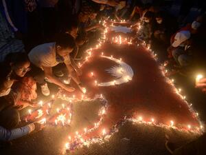 People light candles as they celebrate after the parliament approved a new national emblem with a controversial political map that includes strategic territories disputed with its giant neighbour India, in Kathmandu on June 13, 2020. Nepal's lower house of parliament on June 13 approved a new national emblem with a controversial political map that includes strategic territories disputed with its giant neighbour India. PRAKASH MATHEMA / AFP