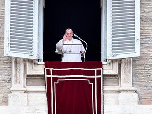 Pope Francis blesses attendees from the window of the Apostolic palace during the weekly Angelus prayer on June 14, 2020 in The Vatican, as the city-state eases its lockdown aimed at curbing the spread of the COVID-19 infection, caused by the novel coronavirus. Tiziana FABI / AFP