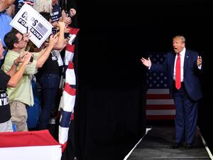 US President Donald Trump arrives for a campaign rally at the BOK Center on June 20, 2020 in Tulsa, Oklahoma. Hundreds of supporters lined up early for Donald Trump's first political rally in months, saying the risk of contracting COVID-19 in a big, packed arena would not keep them from hearing the president's campaign message. Nicholas Kamm / AFP
