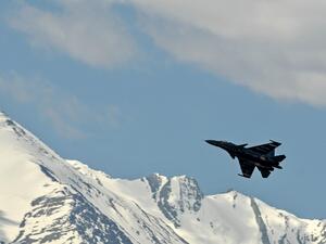 An Indian Air Force aircraft is seen against the backdrop of mountains surrounding Leh, the joint capital of the union territory of Ladakh, on June 27, 2020. India acknowledged for the first time on June 25 that it has matched China in massing troops at their contested Himalayan border region after a deadly clash this month. TAUSEEF MUSTAFA / AFP