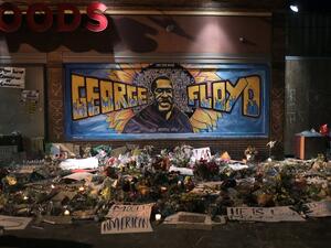 Candles burn at a memorial at the spot where George Floyd was killed, on June 1, 2020 in Minneapolis, Minnesota. With 7,500 national guard troops called up to supplement state and local police, this is the largest domestic deployment of national guard in the state's history. (AFP/File Photo)