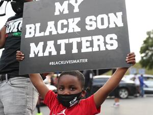 The site has become a place of remembrance for Mr. Brooks, who was killed by police while fleeing after a struggle during a field sobriety test in the Wendy's parking lot. Joe Raedle/Getty Images/AFP