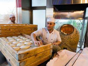 Traditional bread making activity for a commercial food chain in Jordan (Shutterstock)