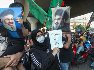 Supporters of the Lebanese Shiite movements Hezbollah and Amal lift pictures of Hezbollah's leader Hassan Nasrallah and anti-US placards as they protest a statement made by the US ambassador criticising the group, at a rally in the southern suburb of the capital Beirut, on June 28, 2020. ANWAR AMRO / AFP