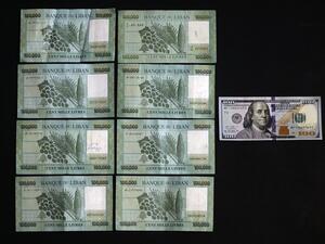 A picture taken on June 29, 2020 shows the black market rate, as calculated by specialised websites, of 100 USD in Lebanese Liras on the day of shoot on June 29. The Lebanese currency officially remains pegged at around 1,507 pounds to the dollar, but the black market rate on Monday morning reached a new record of 8,000, according to several specialised websites. The cap on dollar withdrawals has led those in need of the foreign currency to resort to changers on the black market instead, sending the exchang