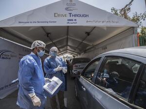Egyptian health workers collect samples at a drive-through coronavirus-testing center at the Ain Shams University in Cairo on June 29, 2020. Egypt has so far registered 65,188 COVID-19 cases including 2,789 fatalities. Khaled DESOUKI / AFP