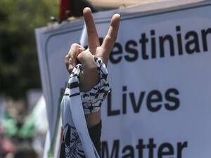 A Palestinian demonstrator flashes the victory sign during a rally as Palestinians call for a "Day of Rage" to protest Israel's plan to annex parts of the occupied West Bank, in Gaza City on July 1, 2020. Expectations of a major Israeli announcement on controversial annexations in the occupied West Bank dimmed, as global criticism of the project mounted and Palestinian protesters began gathering in Gaza. MAHMUD HAMS / AFP