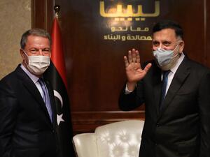 Fayez al-Sarraj (R), Prime Minister of Libya's UN-recognised Government of National Accord (GNA) receives Turkish Defense Minister Hulusi Akar, in the Libyan capital Tripoli on July 3, 2020.  AFP